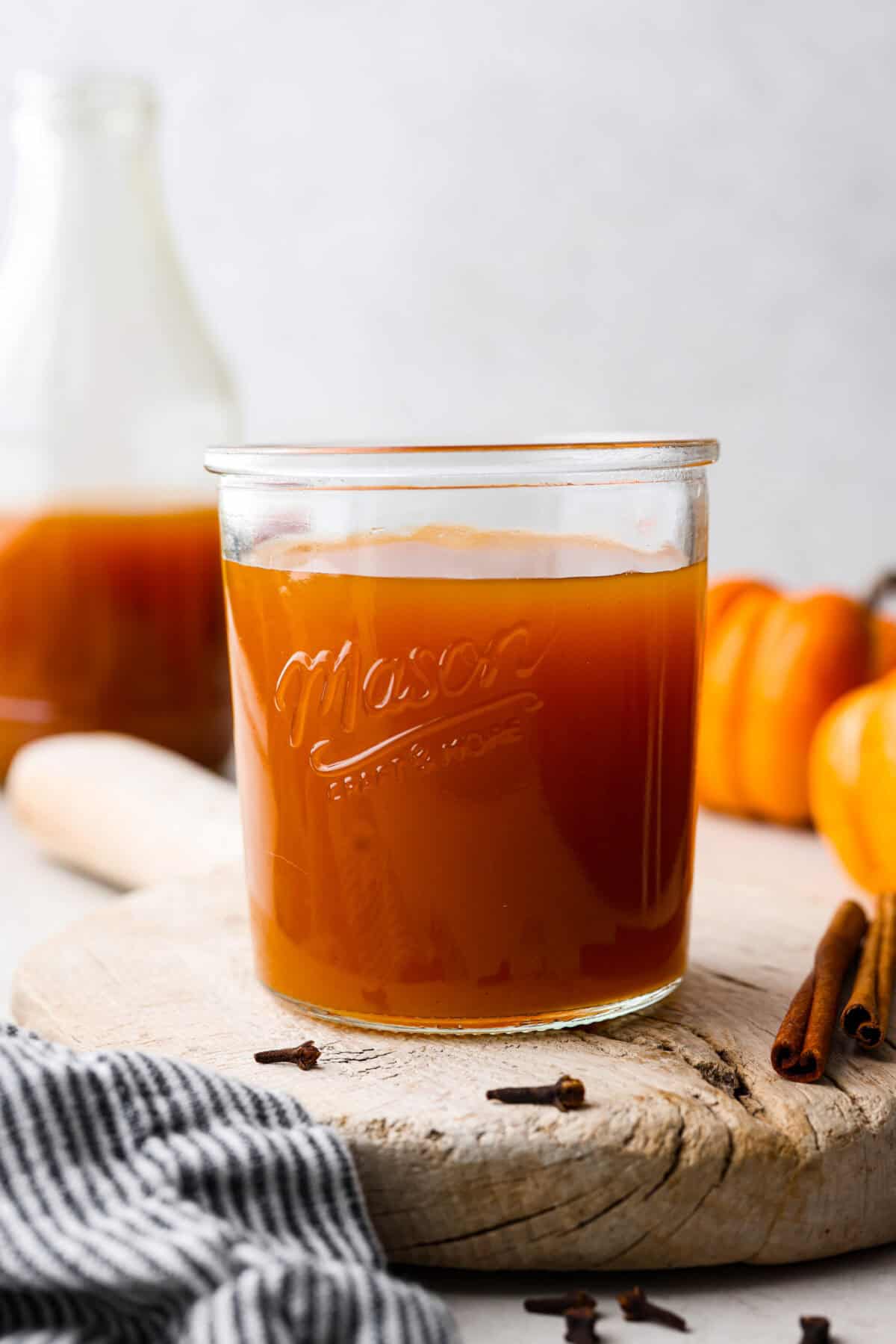 This Harry Potter Pumpkin Juice will transport you to a magical ride on the Hogwarts Express or eating lunch with your friends in the great hall. Bursting with warm, cozy fall flavor, you will love feeling part of the wizarding world of Harry Potter with this magical drink. Close up shot of pumpkin juice in a glass cup.